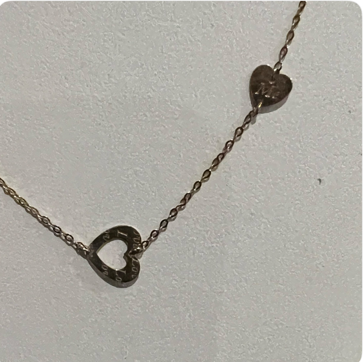 cut out hearts charm necklace in 9ct yellow gold