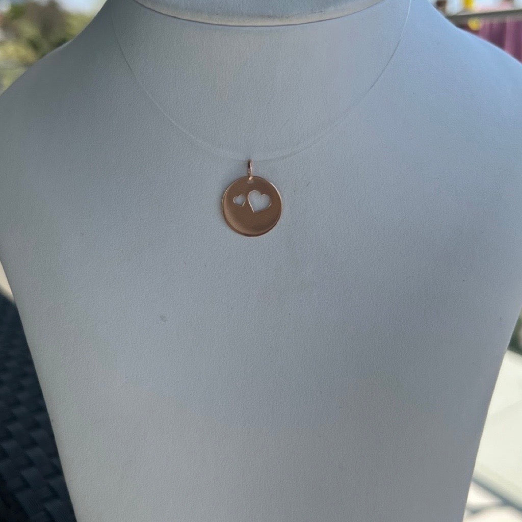 rose gold disc with heart cutouts