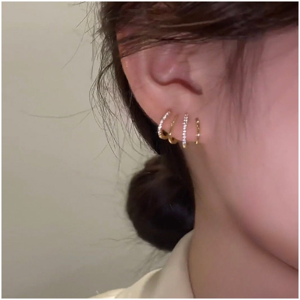 4 in one earrings in gold on models ear