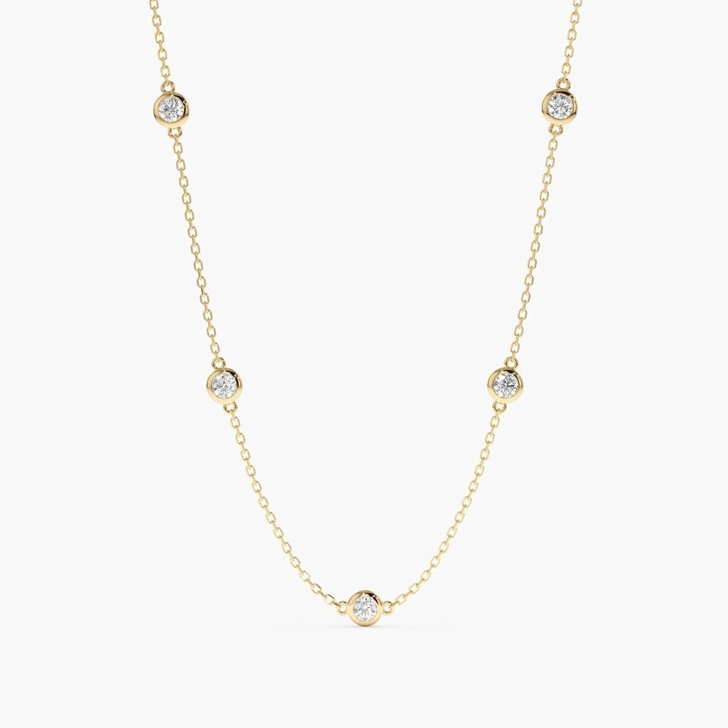 9kt yellow gold by the yard necklace with cubic zirconias in a bezel setting