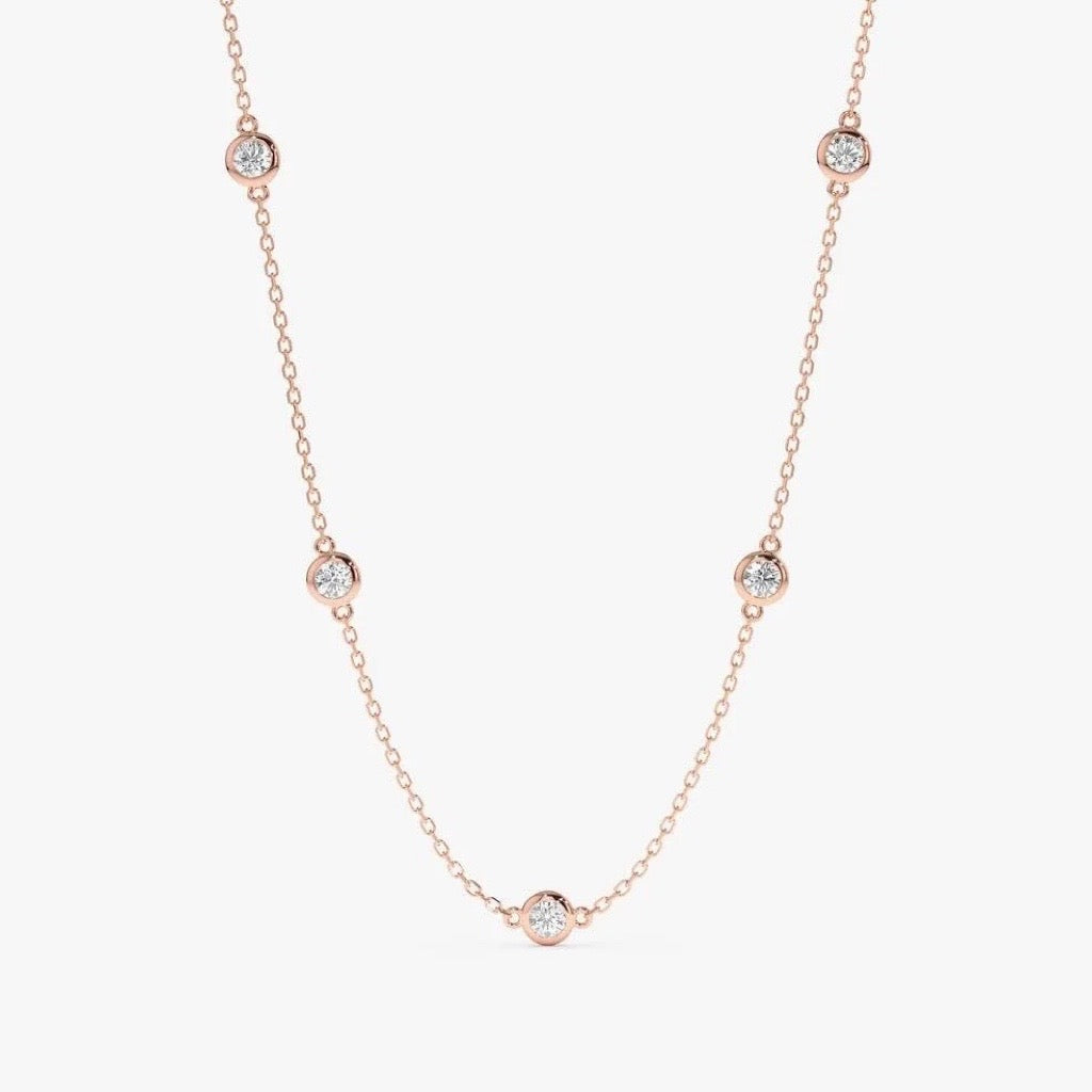9kt rose gold by the yard necklace with cubic zirconias in a bezel setting