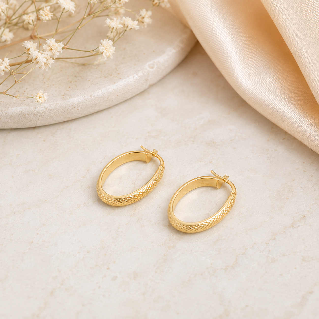 9ct Yellow Gold Diamond-Cut Oval Hoop Earrings