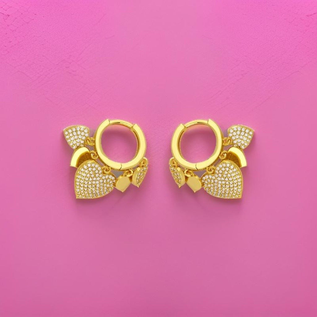 Heart Charm Huggie Earrings in gold with cubic zirconias