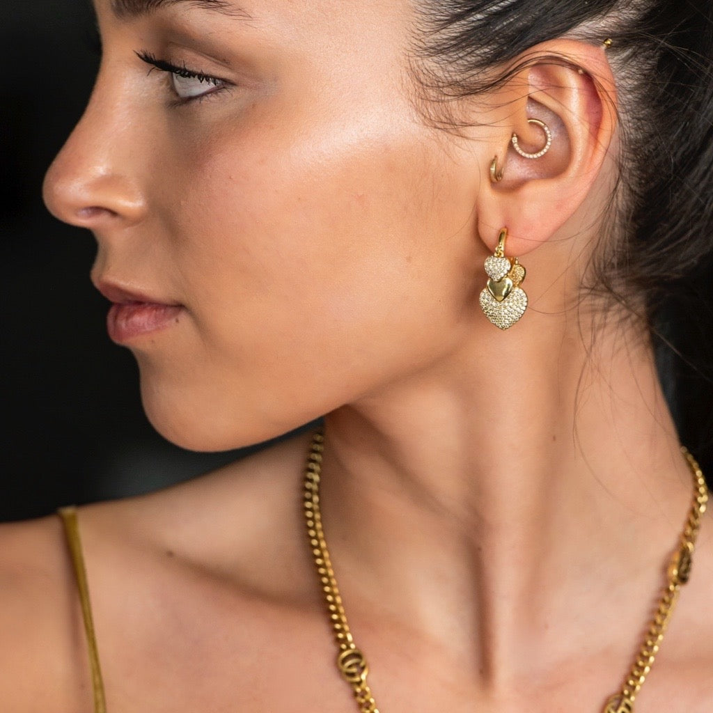 Heart Charm Huggie Earrings in gold with cubic zirconias