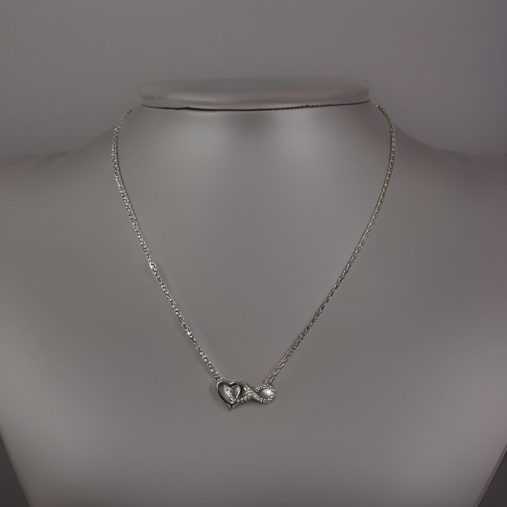 infinity heart pendant necklace with silver heart and infinity sign covered in cubic zirconias intertwined