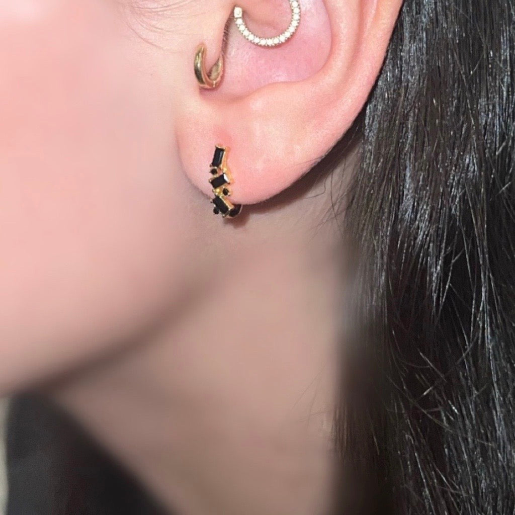 U Shaped Huggie Earrings Black and Gold on model