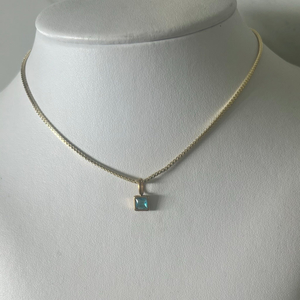 three box chain necklaces layered in 14k gold