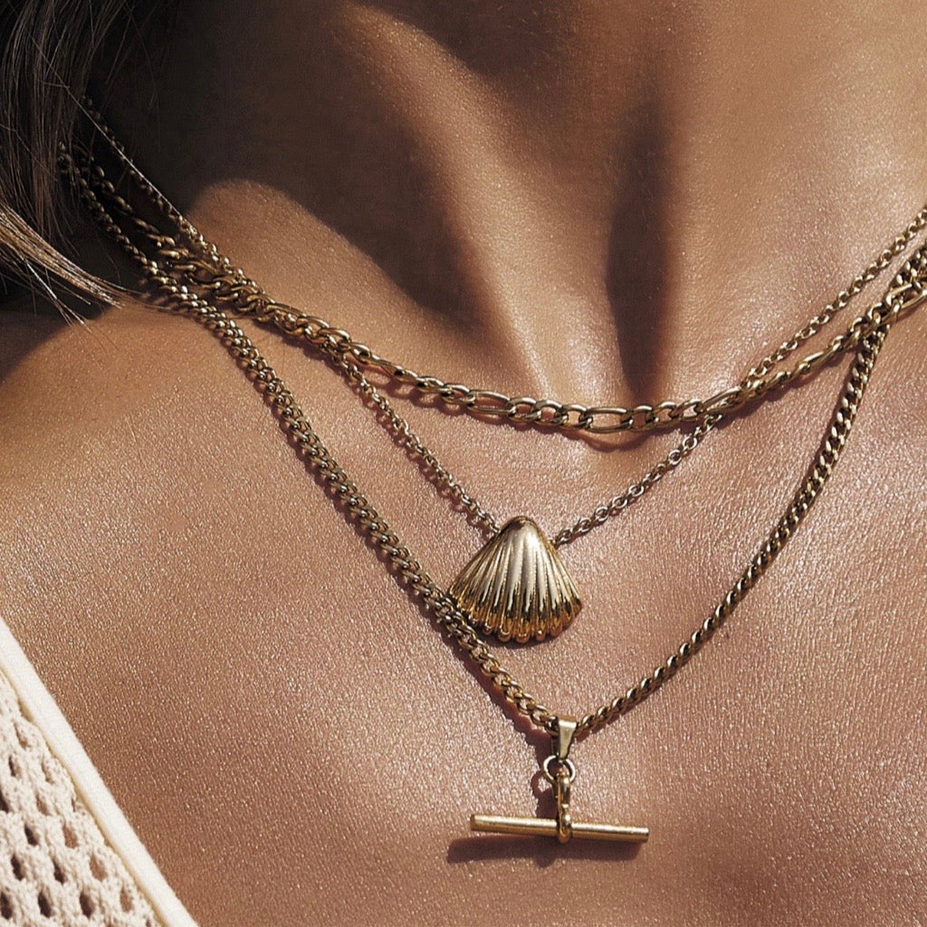 two chains in gold with fob pendant