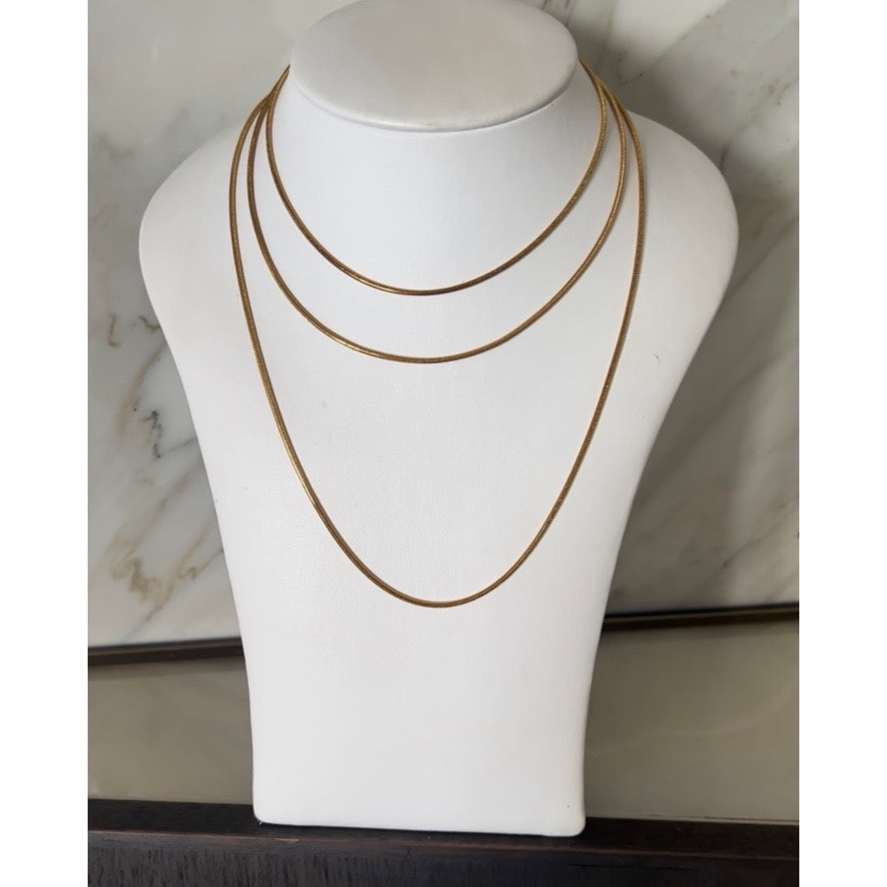extra long necklace wrapped three times around mannequin showing layers
