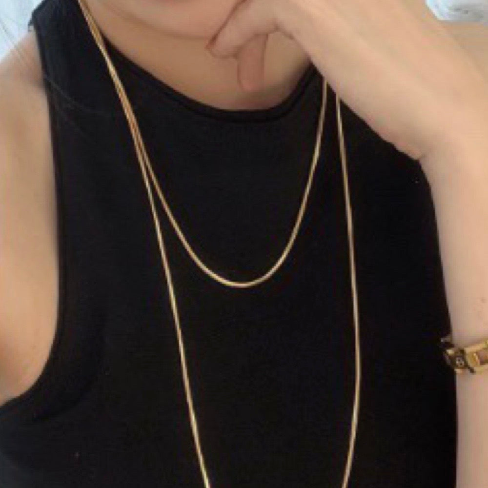 extra long necklace on model wrapped around twice to show layering 