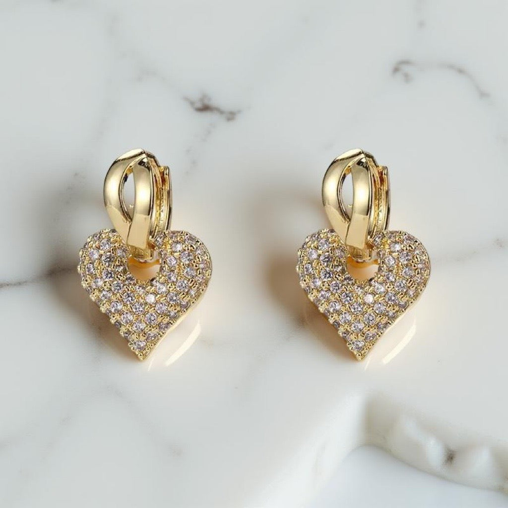 heart huggies in gold with cubic zirconia heart charms 