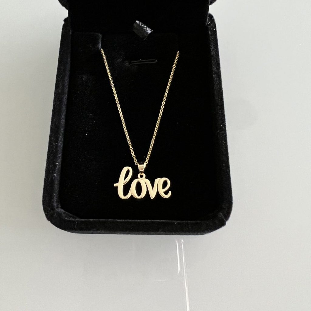 love pendant on chain in box