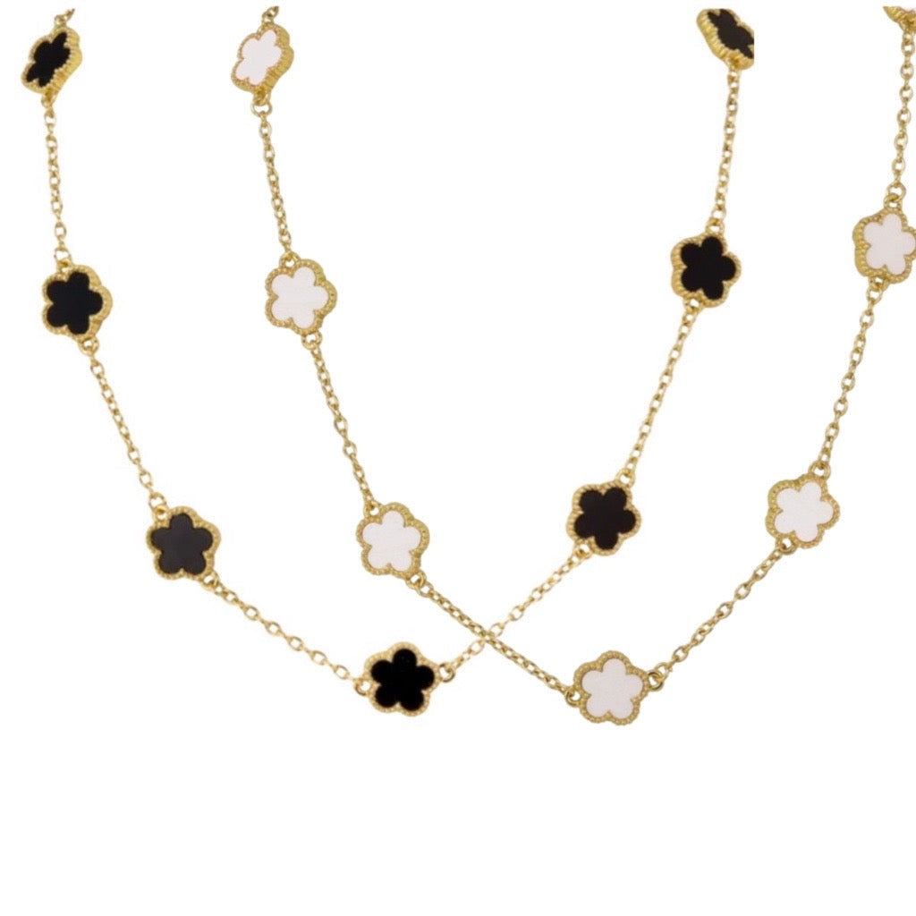 multi clover necklaces in black and gold and white and gold