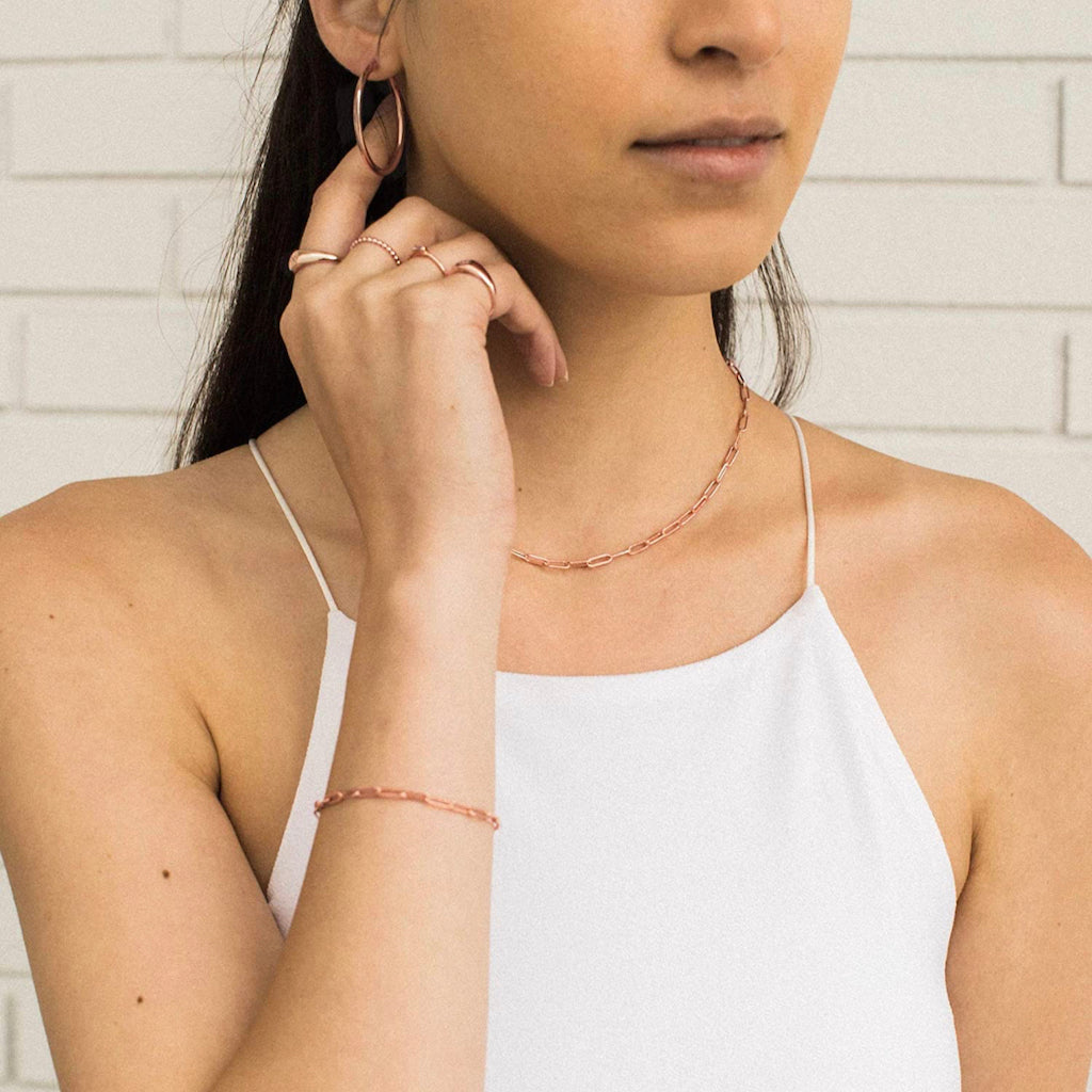 Paperclip Necklace in 9kt rose gold on model with matching paperclip bracelet
