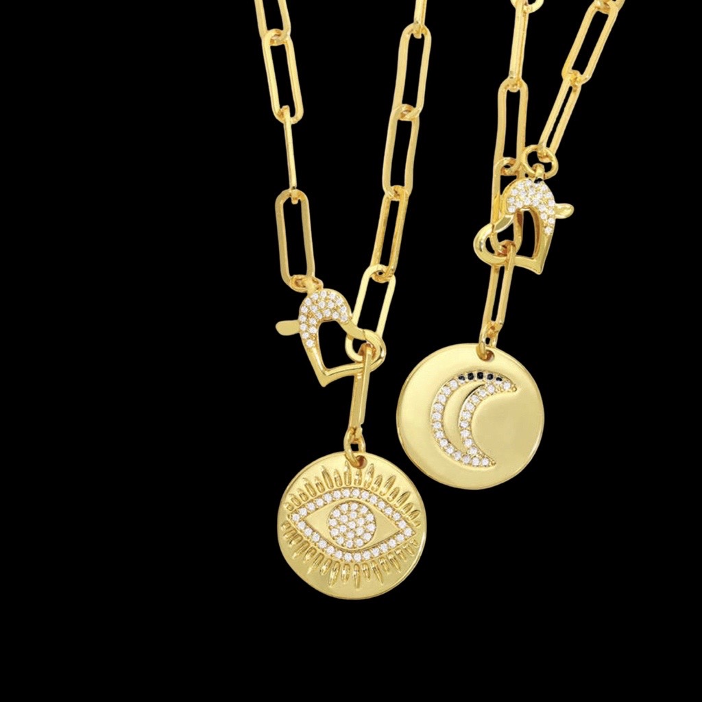 paperclip necklace with disk and half moon design in cubic zirconias