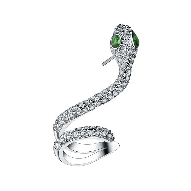 silver snake cuff earring with cubic zirconias and green eyes. sold as a single earring
