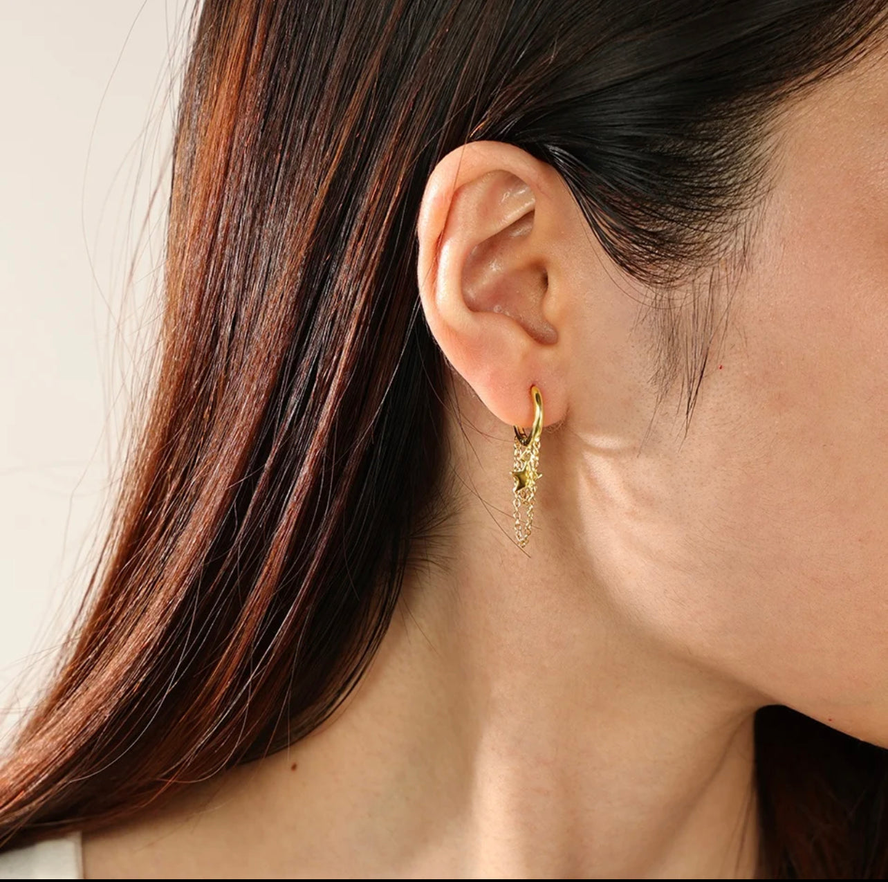 huggie earrings with drop chains and stars