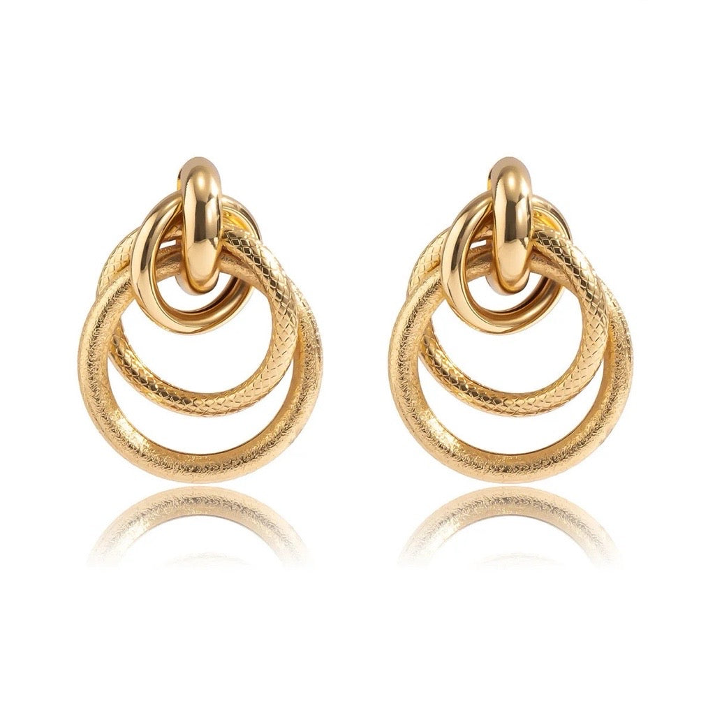 statement gold hoop earrings looped together in gold plated