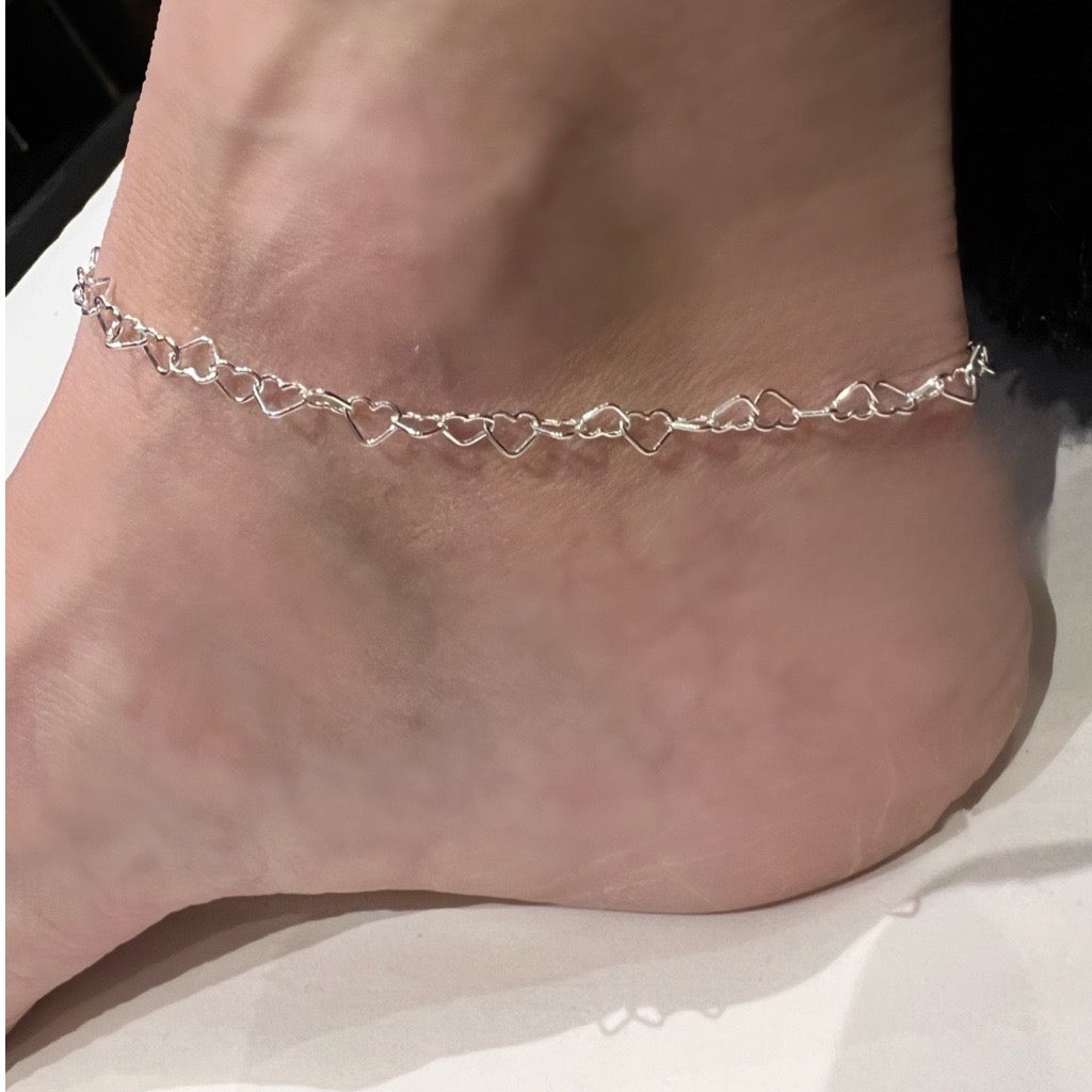 intricate silver hearts linked together ankle chain